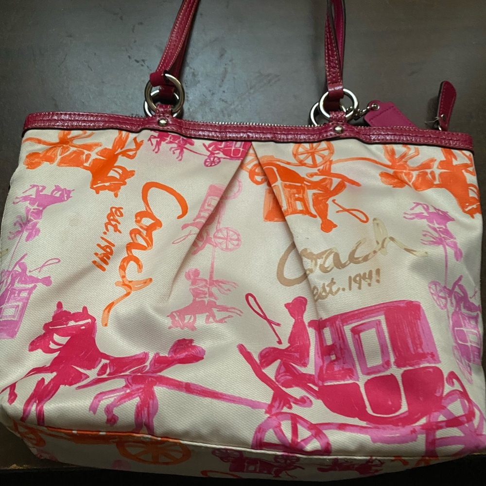orange and pink coach hand bag